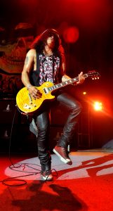 Photograph of Slash on stage at Victoria Hall, Hanley
